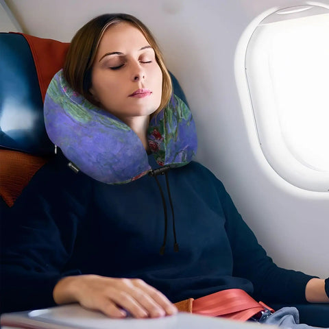 Woman using Monet Water Lilies Travel Neck Pillow With Washable Cover Memory Foam Support Cushion on airplane