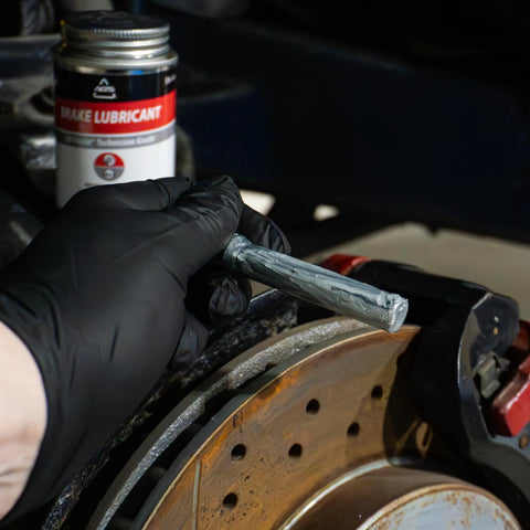Applying Premium 4oz Brush Top SIL Glyde Silicone Brake Grease for Calipers and Brake Lubrication by AGS Automotive Solutions