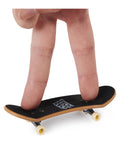 Fingerboard Bonus Pack With Six Real Graphic Mini Skateboards, customizable set with fingers demonstrating play on mini board.