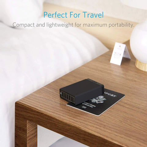 Six Port 60W USB Charging Hub For iPhone iPad MacBook Galaxy LG HTC And More With Fast Charging Tech And Overload Protection Ideal Desktop Or Travel Charging Station on a wooden desk