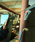 Magnetic Welding Ground Clamp With On Off Switch 40 Kg Pull 300 Amp Rated Ground Block in use on metal pipe and plate