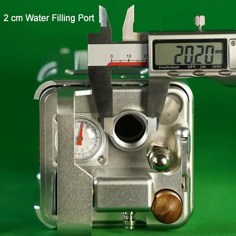 Close-up of Portable Pneumatic Espresso Maker With 58mm Portafilter And Dual Pressure Gauges showing 2 cm water filling port measurement.