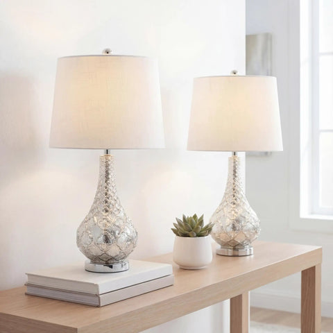 Mercury Silver Glass Table Lamp Set Of 2 With White Linen Shades, 25.5 Inch displayed on a wooden table in a bright room, LED Bulbs Included