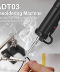 Automatic Desoldering Pump Vacuum Solder Sucker Portable Electric Desoldering Tool 110V 30W in action with metal alloy tip
