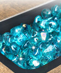 Caribbean Blue 20 Pound 1 Inch Fire Glass Diamonds For Gas Fire Pit And Fireplace showcasing high luster sparkling glass rocks