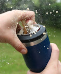 Hella Tough Navy Blue Four In One Insulated Stainless Steel Drink Koozie opening 12 oz can, spilling beverage.