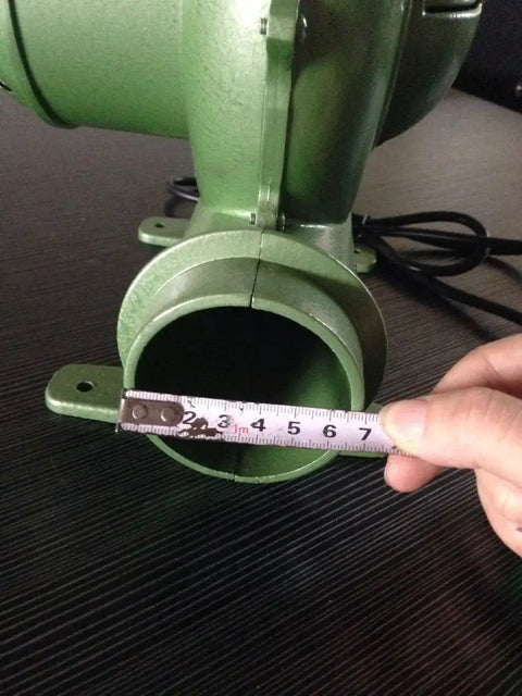 Close-up of Electric Blacksmith Forge Blower 110V 250W For Coal Fires with ruler measuring outlet diameter 380Pa pressure