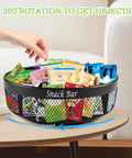 Xbopetda black metal 4-compartment lazy Susan snack organizer on countertop, filled with snacks.