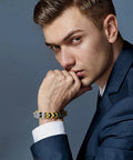 Man wearing a bracelet made with 200 Piece Mini Crown Charms For Jewelry Making Colorful Gold And Silver Mixed Metals Large Hole Spacer Beads.