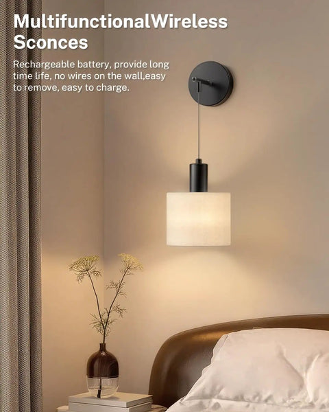 Cordless Battery Operated Wall Sconces Set Of 2 With Remote Control, mounted in bedroom, modern black fixture with beige shade.
