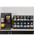 12 Count Modular Merchandiser for Coffee Stations with Slim Space Saving Design and K-Cup pods on a counter in break room