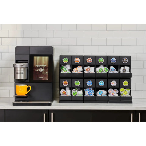 12 Count Modular Merchandiser for Coffee Stations with Slim Space Saving Design and K-Cup pods on a counter in break room