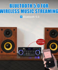 AK50 Amplifier For Home Audio With Bluetooth 5.0 and two wooden speakers.