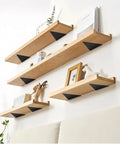 Five Pack Hidden Stainless Steel Shelf Brackets For White Walls Invisible Triangular Wall Mounts supporting wooden shelves.