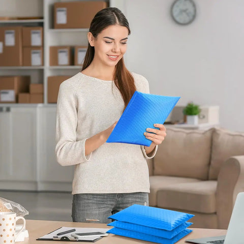 Woman holding Blue Large Bubble Mailers 12x16 Inch 25 Pack Usable 12x15 Inch Self Seal Padded Envelopes Waterproof Heavy Duty