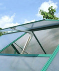 Solar Heat-Sensitive Automatic Greenhouse Vent Opener Kit With Single Spring installed on greenhouse roof.