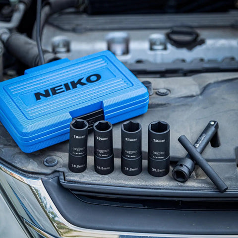 Half Size One Half Inch Impact Thin Wall Flip Lug Nut Socket Set With 5 Inch Extension Bar And Knockout Bar displayed on car engine