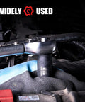 Seventy Piece Three Eighth Inch Drive Heavy Duty Impact Socket Set With Deep Sockets In SAE Five Sixteenths To Three Quarters And Metric Eight To Twenty Two Millimeter Includes Adapters Ratchet Handle Screwdriver Bit Set And Sliding T Bar Six Point in use on automotive engine.