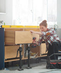Woman installing kitchen cabinets using Third Hand Cabinet Support Pole, Heavy Duty Jack For Installing Cabinets, 200 Lbs Capacity, Extends From About 15.8 Inches To 23.6 Inches, 2 Piece Set, A Handy Drywall Trim Shelving Helper That Feels Like An Extra Hand On Deck.