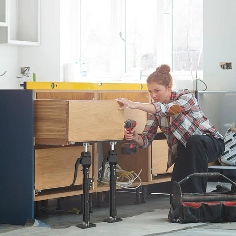 Woman using Heavy Duty Third Hand Support Pole For Cabinet Installations With 200 Lbs Capacity Extends From 23.6 In To 45.3 In Two Piece For DIY Cabinets And Woodworking Projects