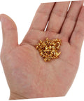 Hand holding golden brads for 200 Pieces Metal Paper Fasteners Brads Set For Paper Crafts And Scrapbooking Decorative Clips Miniature