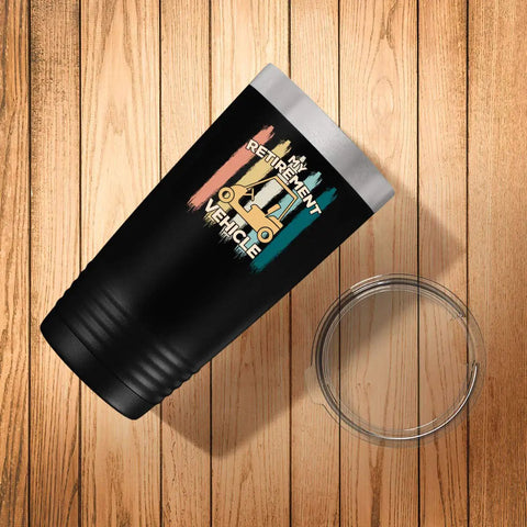 My Retirement Vehicle Golf Cart Tumbler 20 Oz Black Stainless Steel with logo on wooden surface.