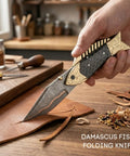 Hand holding Damascus Fish Style Folding Knife With Ladder Pattern Blade Handmade Damascus Steel Pocket Knife