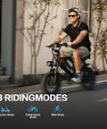 Man riding Compact 16 Inch Fat Tire Electric Bike For Teens And Adults With 500W Motor 36V 12.8Ah on urban road