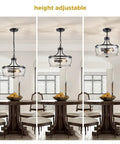 Firedanz 3-Light Glass Pendant Light, Height Adjustable displayed in three heights above a wooden dining table.