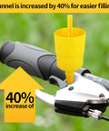 Brake Bleed Kit For Shimano Hydraulic Brakes With Mineral Oil 120ml, yellow funnel attached to brake lever for easy filling