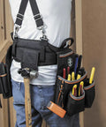Tradesman Pro Electrician Padded Tool Belt And Pouch Set With Removable Pockets Breathable Mesh Belt Wide Open Loops For Drill Bits Tape Measure Hammer And Parts Fits 31 To 34 Inch Waists worn by person with tools