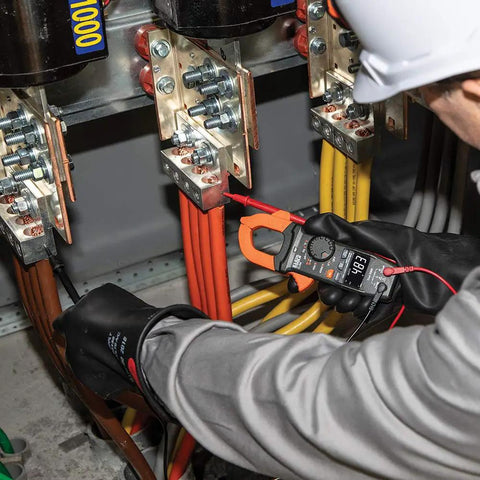 Pro Grade AC DC Digital Clamp Meter With Auto Ranging 400 Amp Capacity Non Contact Voltage Tester in use by electrician
