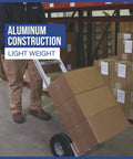 Person using Aluminum Hand Truck With 600 Pound Capacity For Moving Boxes And Crates, Continuous Flow Handle in warehouse