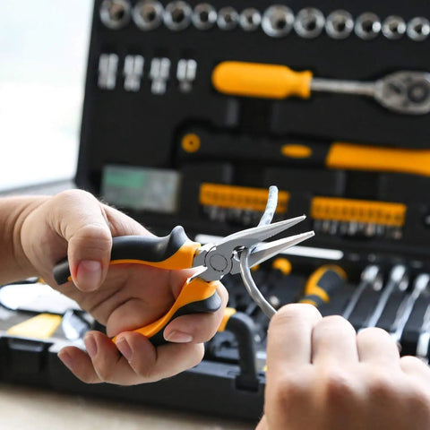 Using pliers from 128 Piece General Household Tool Set With Auto Repair Tools In A Plastic Toolbox Storage Case Chrome Finish