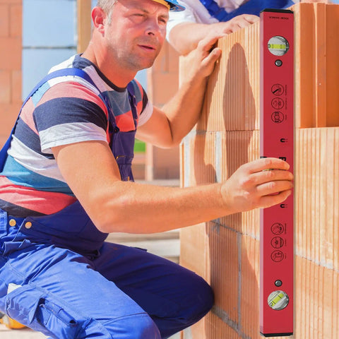 Man using Heavy Duty 16 Inch Magnetic Torpedo Spirit Level With Three Precision Vials for 45 90 180 degree layouts.