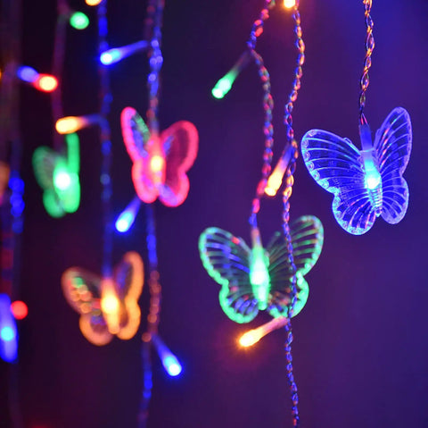 Butterfly Curtain Lights 13ft 96 LED Fairy String With Remote 8 Modes Multicolor Vibe glowing in dark setting