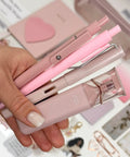 Close up of pink pens and pencil from Aesthetic Stationery Gift Set 22 Piece Bundle With Journal Box Blush Pink Includes Pencil Pouch Pens Eternal Pencil Stickers And Coordinated Accessories For Journaling Planning Studying And Daily Grind Organization.