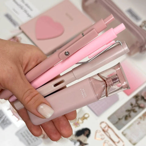 Close up of pink pens and pencil from Aesthetic Stationery Gift Set 22 Piece Bundle With Journal Box Blush Pink Includes Pencil Pouch Pens Eternal Pencil Stickers And Coordinated Accessories For Journaling Planning Studying And Daily Grind Organization.