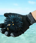 Heavy Duty Safety Work Gloves For Men And Women With A9 Cut Protection holding a sea urchin by the ocean