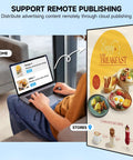 User operating laptop to manage Ready To Roll 55 Inch 4K Digital Menu Board Wall Mount Commercial Signage Display.