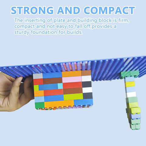 Four 10x10 Classic Building Brick Baseplates Set In Green Black Blue And Dark Grey For Totally Creative City Castle And Vehicle Builds, A Universal Play Surface To Expand Any Brick World And Boost Multiplayer Fun. blue brick baseplate held in hand, showing firm ABS build