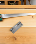 Stainless Steel Hydraulic Buffer Door Hinge With 90 Degree Positioning And Strong Spring on wooden table with saw
