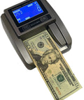 Effortlessly Verify Legit Greenbacks On The Go With This Hella Fast Portable Counterfeit Detector Machine scanning a $20 bill.