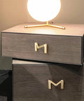 Dope Brushed Gold Cabinet Handles 64mm Drawer Pulls For Wardrobes And Furniture on wooden drawers with lamp