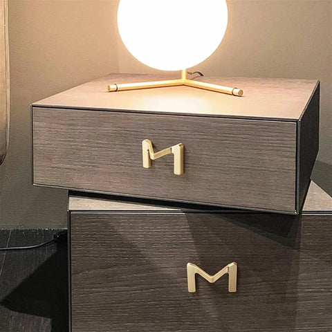 Dope Brushed Gold Cabinet Handles 64mm Drawer Pulls For Wardrobes And Furniture on wooden drawers with lamp