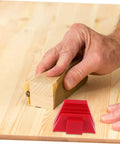 Hand using a sanding block on wood with red Space Saving Wrench Rack Organizer For Garage And Workshop 12 Piece Tool Organizer Tray Labeling Wrench Storage Holder To Speed Up Finding The Right Tool Heavy Duty Wrench Sorter And Wall Mount nearby.