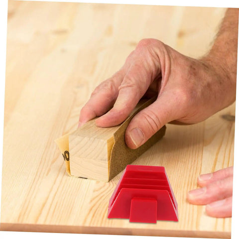 Hand using a sanding block on wood with red Space Saving Wrench Rack Organizer For Garage And Workshop 12 Piece Tool Organizer Tray Labeling Wrench Storage Holder To Speed Up Finding The Right Tool Heavy Duty Wrench Sorter And Wall Mount nearby.