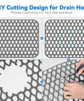 DIY cutting design on 2 Pack Silicone Sink Mats Dope Non Slip Foldable Grids For Kitchen Sinks, showing user cutting mat.