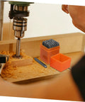 Drill setup with Sturdy 37 Piece Metal Letter Punch Set for Card Making and DIY Crafts beside wood carving area.