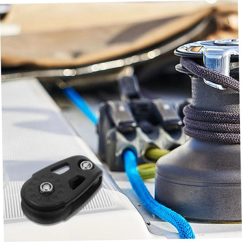 Close-up of Kayak Anchor Trolley Kit With Nylon Single Sheave Blocks For Canoe And Boat Heavy Duty Bearing Pulleys on deck